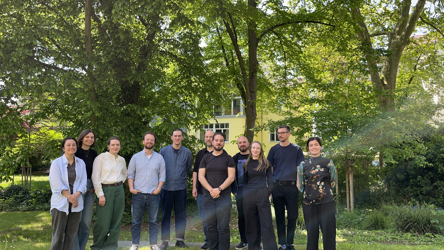 Workshop participants standing in front of trees